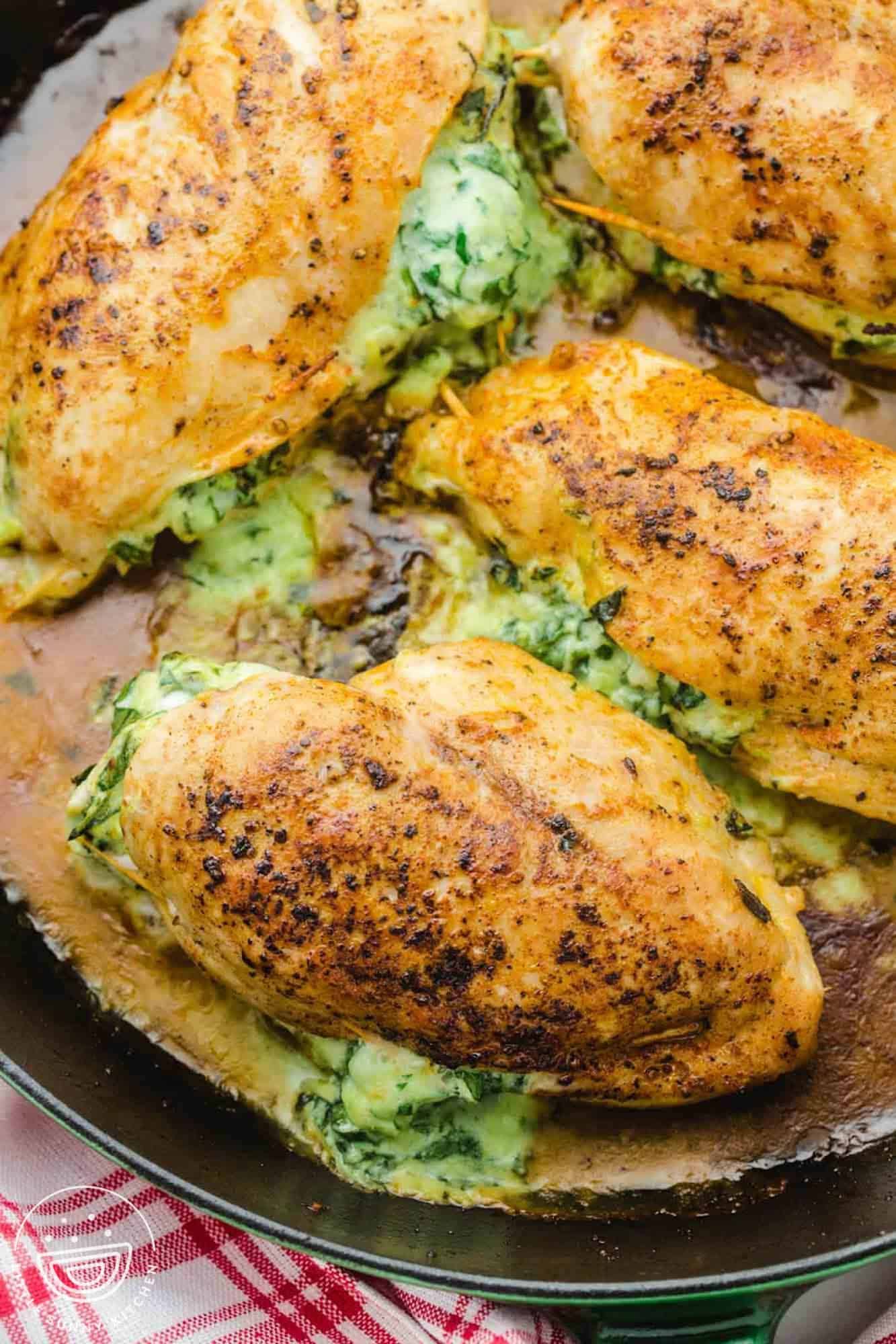 Spinach stuffed chicken breast with mashed potatoes and broccoli