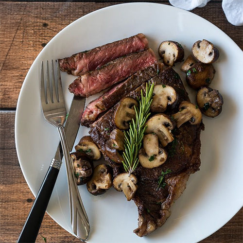 Sliced Ribeye Steak With Mushrooms and Potatoes