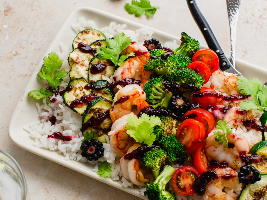 Grilled shrimp over vegetable rice