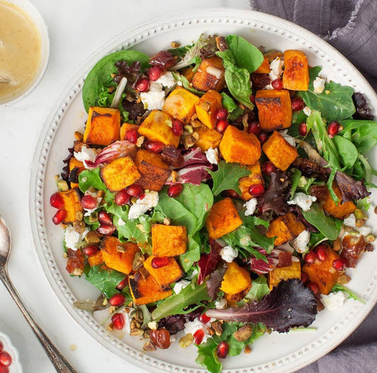 Butternut squash salad (Mixed greens, pumpkin seeds, tomatoes, red onion, feta cheese, purple cabbage, with a spicy chipotle avocado sauce)