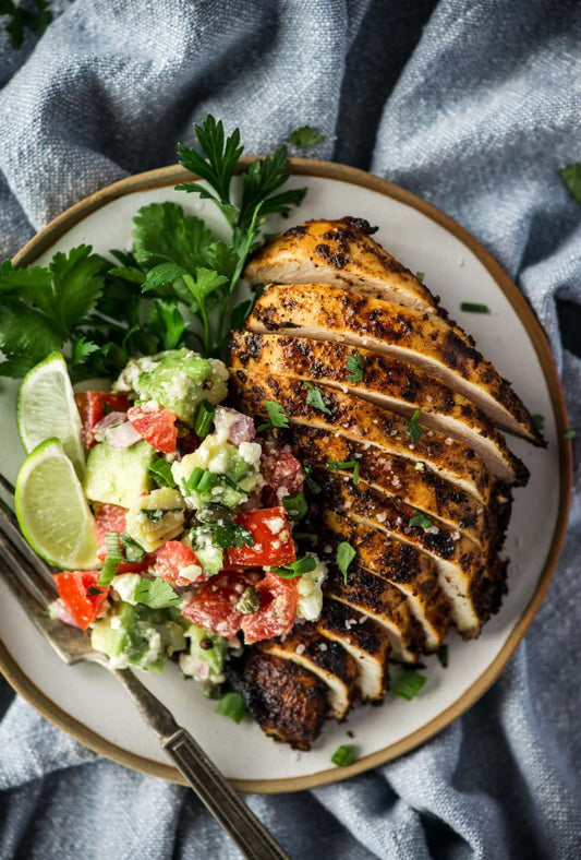 Blackened chicken with broccoli, jasmine rice, and a peach, feta, strawberry, avocado salsa