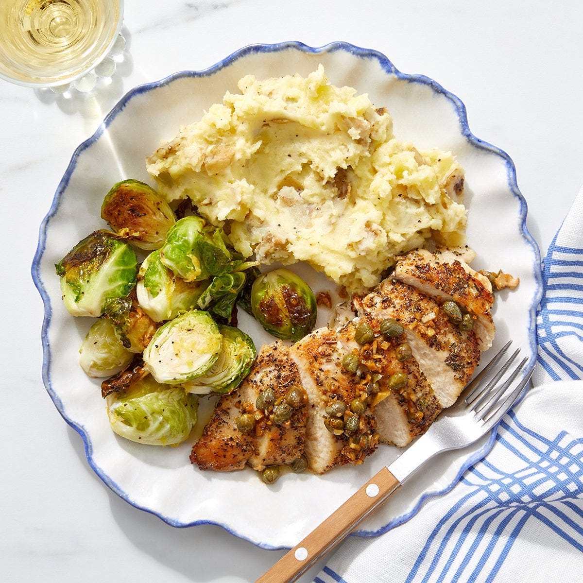 Butter garlic chicken with mashed potatoes, brussel sprouts and cauliflower