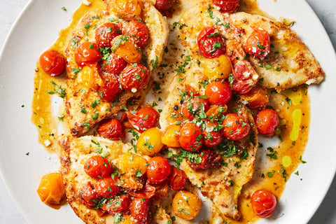 Baked lemon pepper chicken with broccoli, tomatoes, and feta